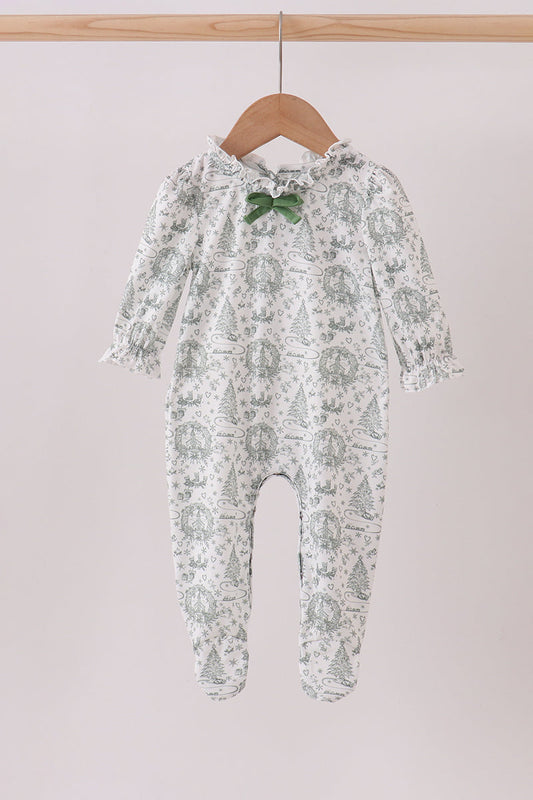Baby onesie with floral pattern on a hanger against a plain background