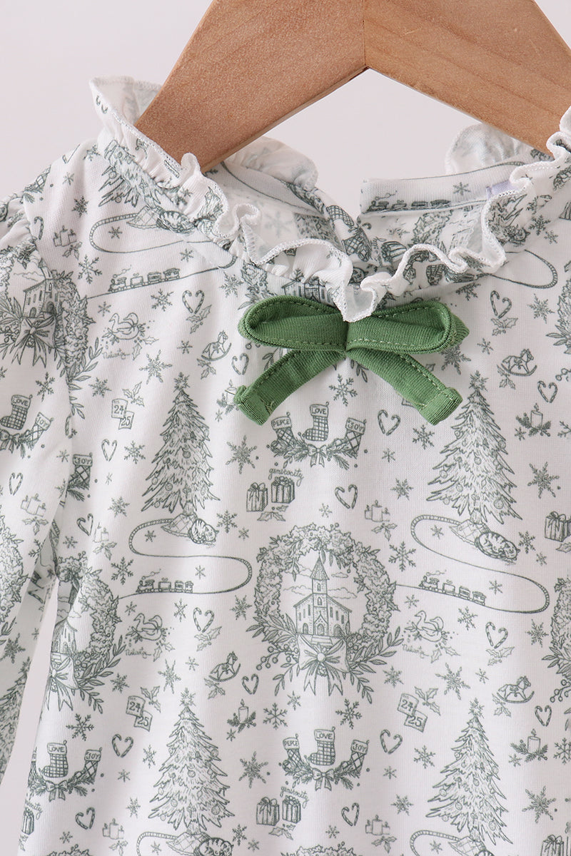 Children's dress with a green bow on a hanger against a white background