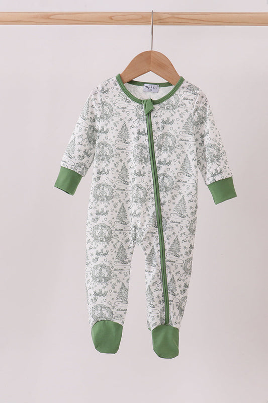 Green and white baby onesie with a pattern on a hanger against a light background