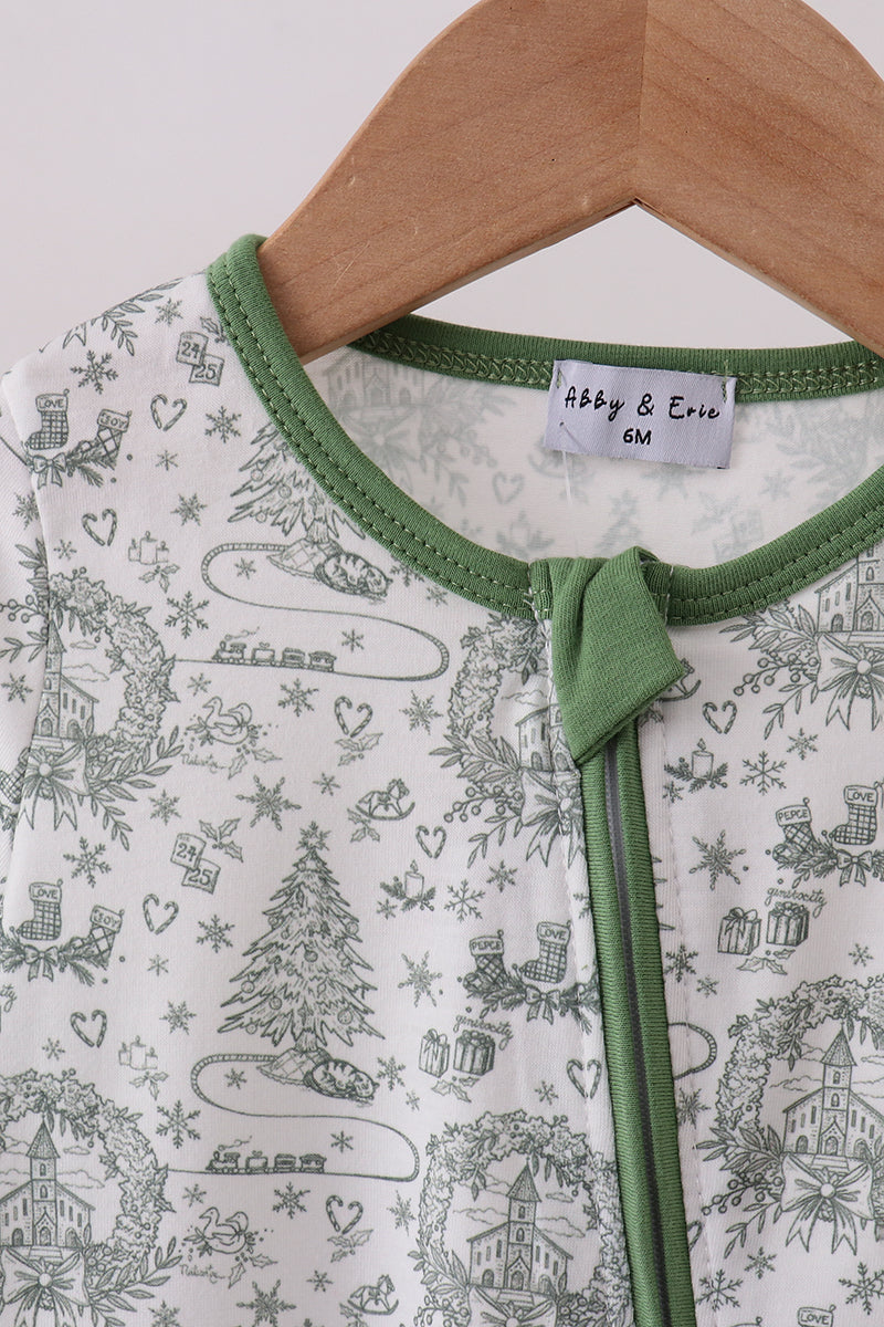 Baby onesie with green trim on a hanger, featuring a Christmas-themed pattern.