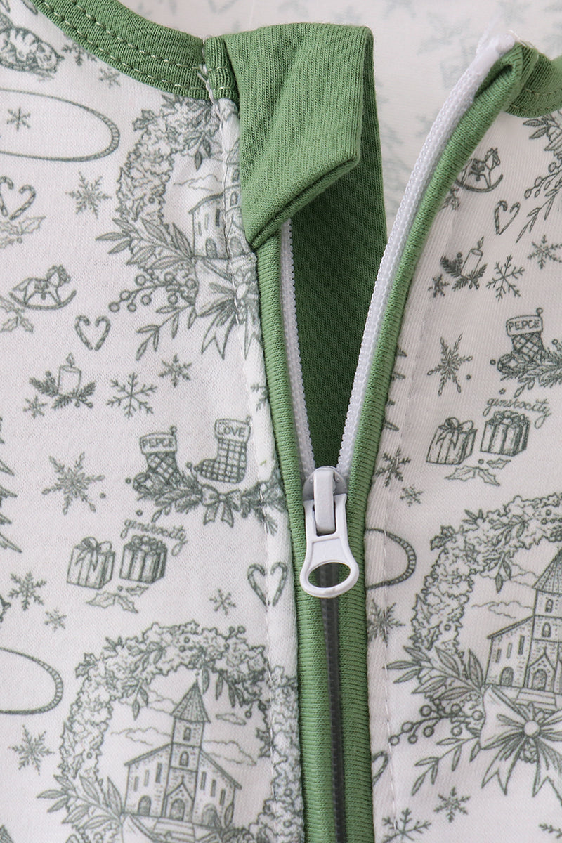 Close-up of a green zipper on fabric with a festive pattern