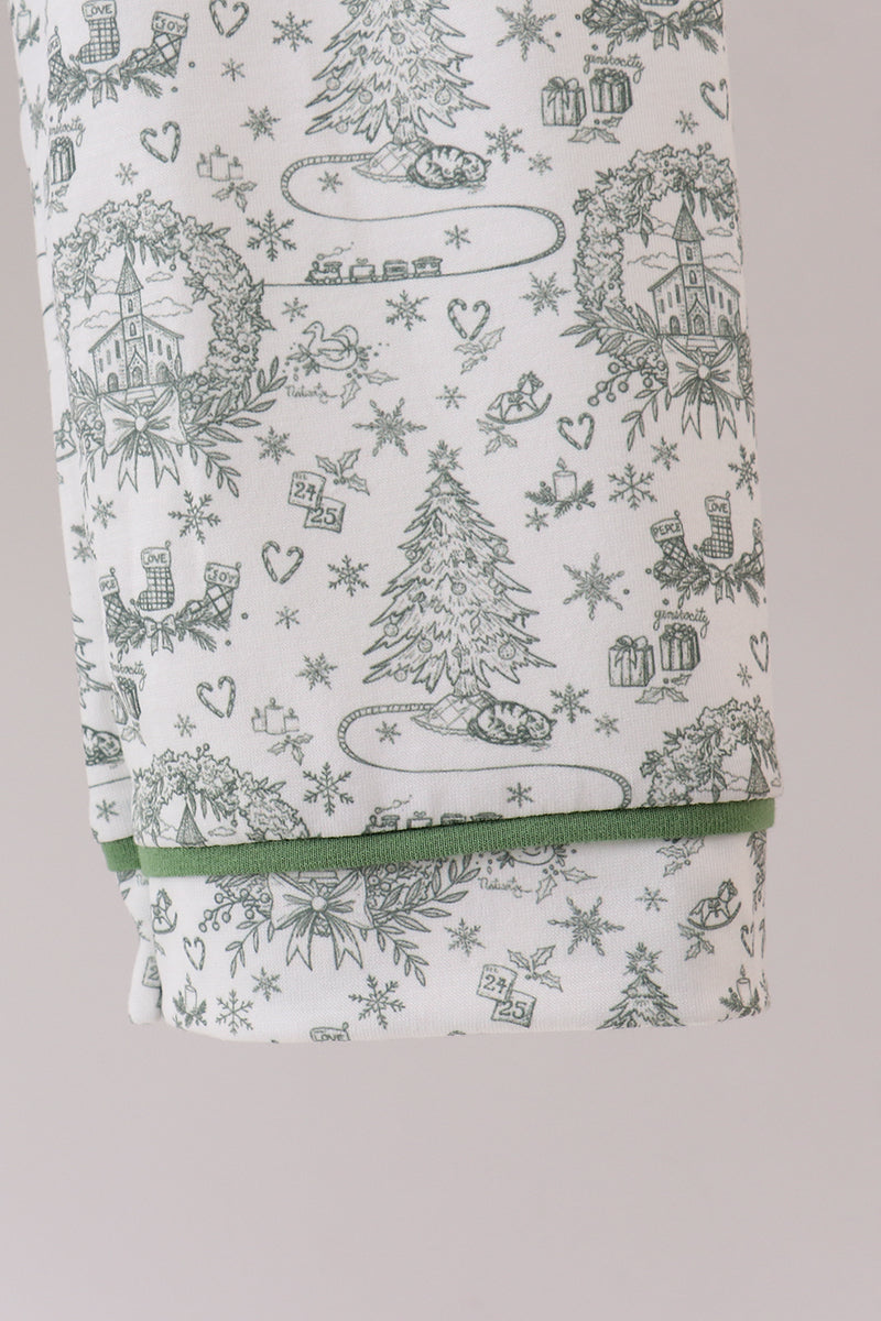Folded fabric with Christmas-themed pattern on a light gray background