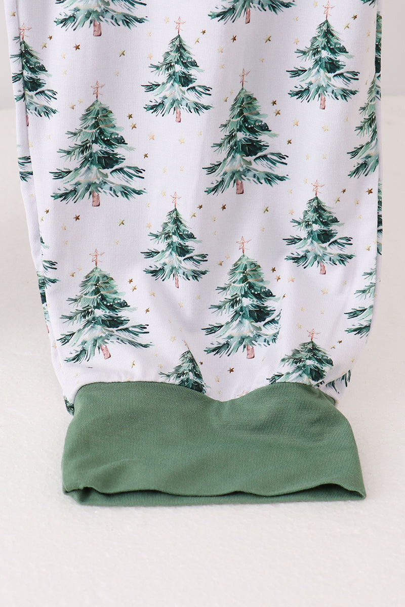 Green leggings with a white pattern of green trees on a white background