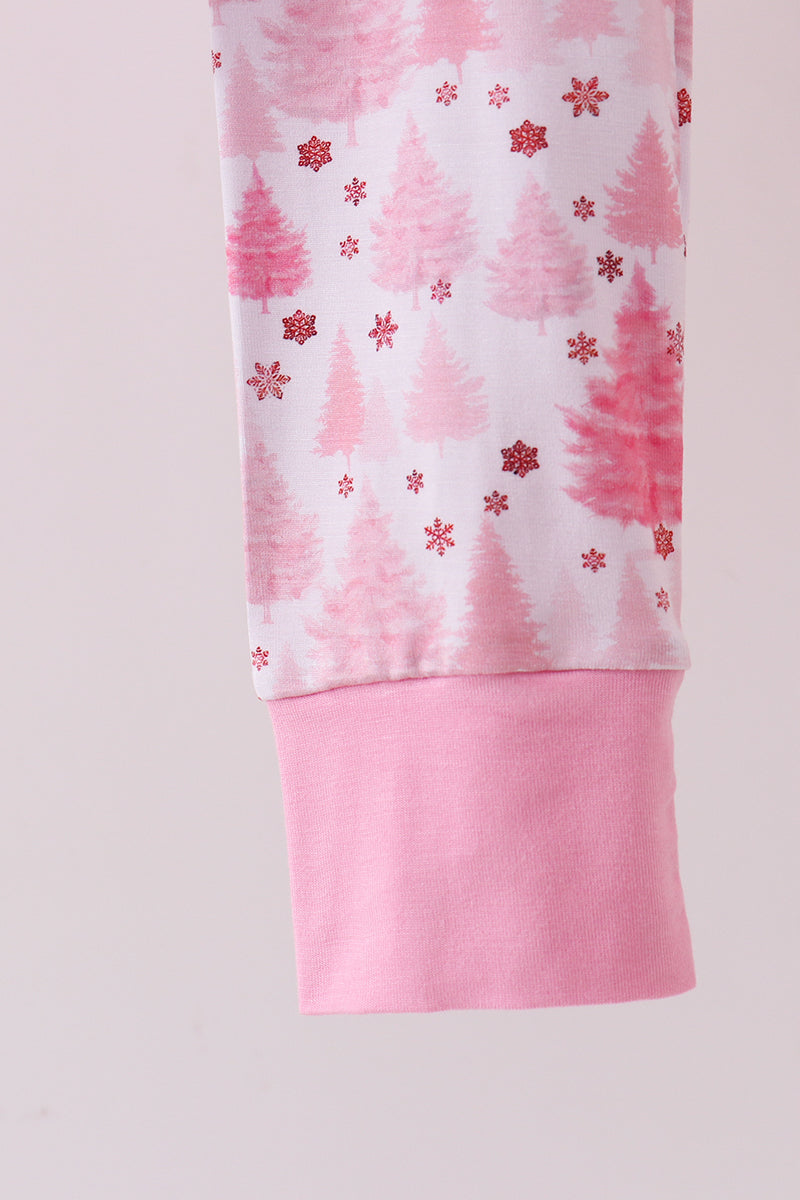 Pink and white patterned leggings with red snowflakes on a light pink background