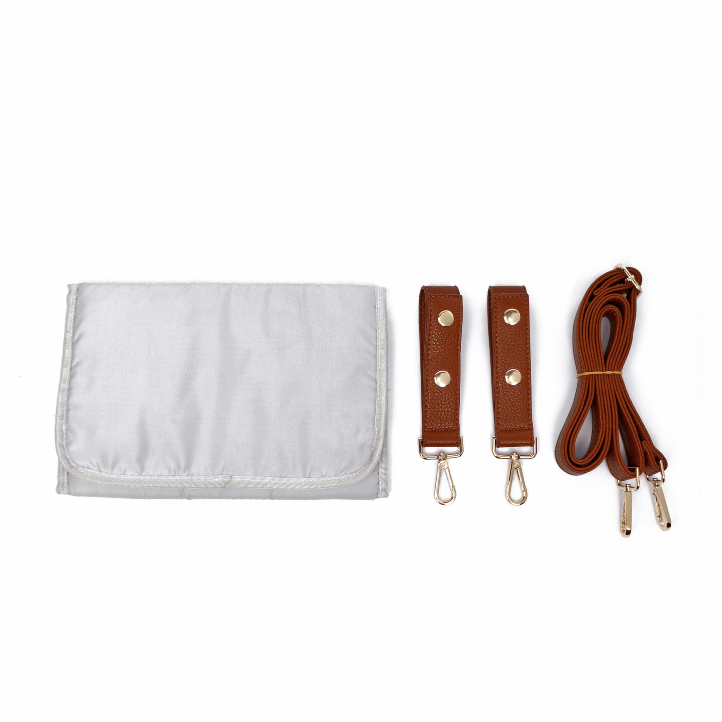 White pouch with brown straps and hooks on a white background