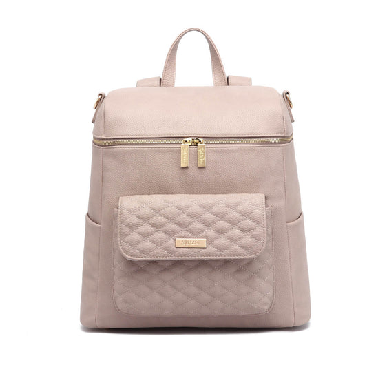 A nude rose colored Monaco Diaper Bag made of vegan leather, featuring a quilted design on the front pocket and smooth exterior.