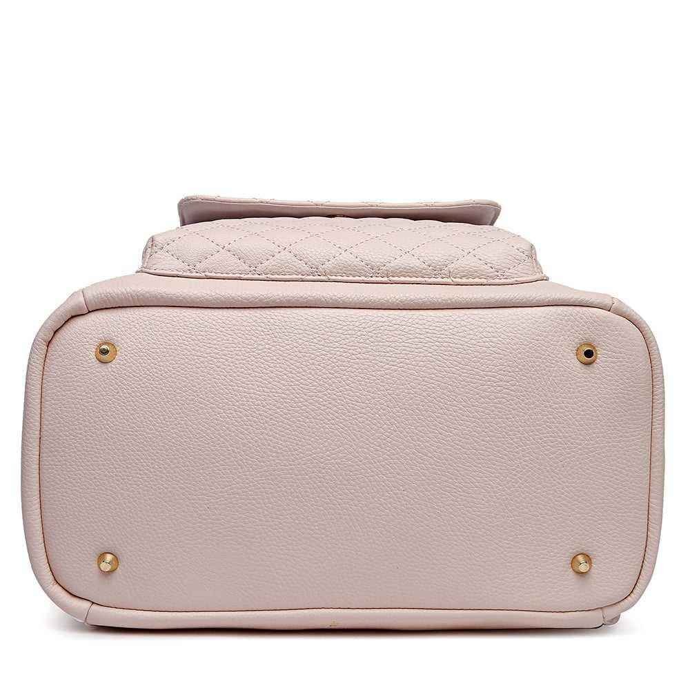 Pink handbag with gold hardware on a white background