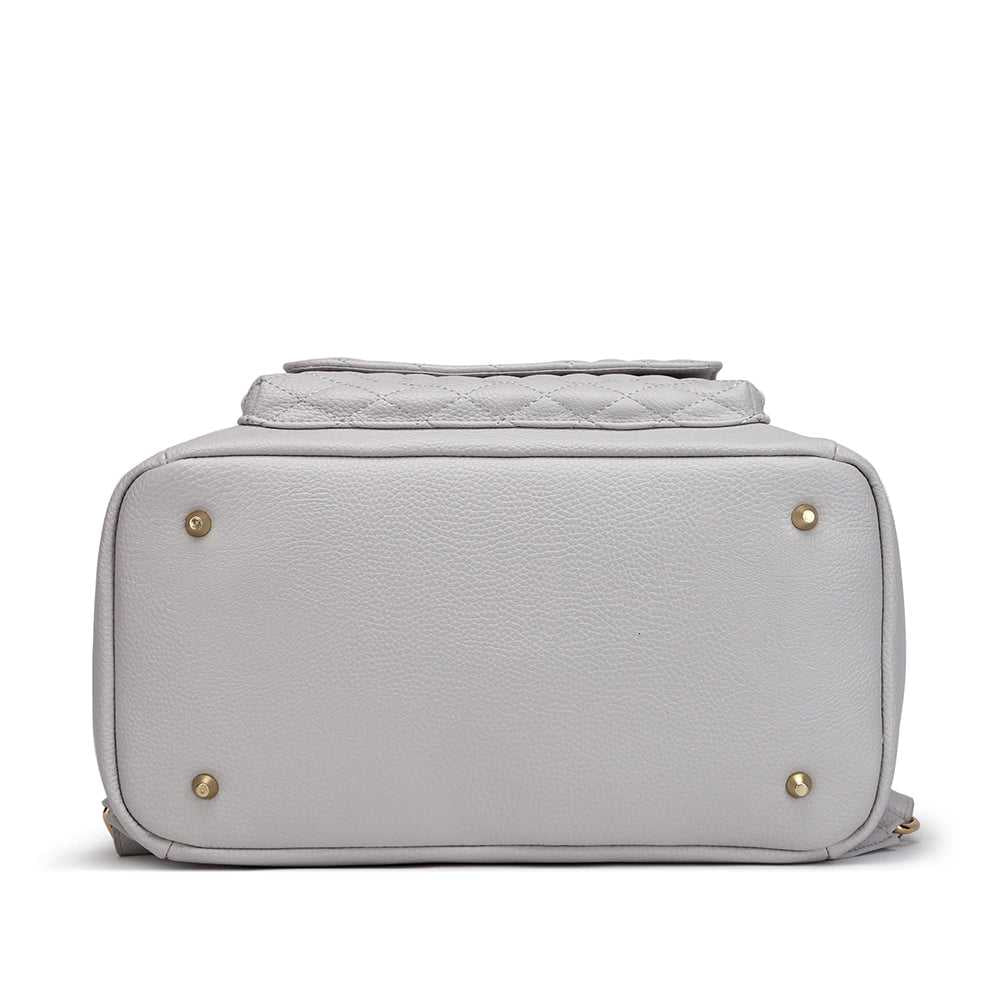 Gray quilted handbag with gold accents on a white background
