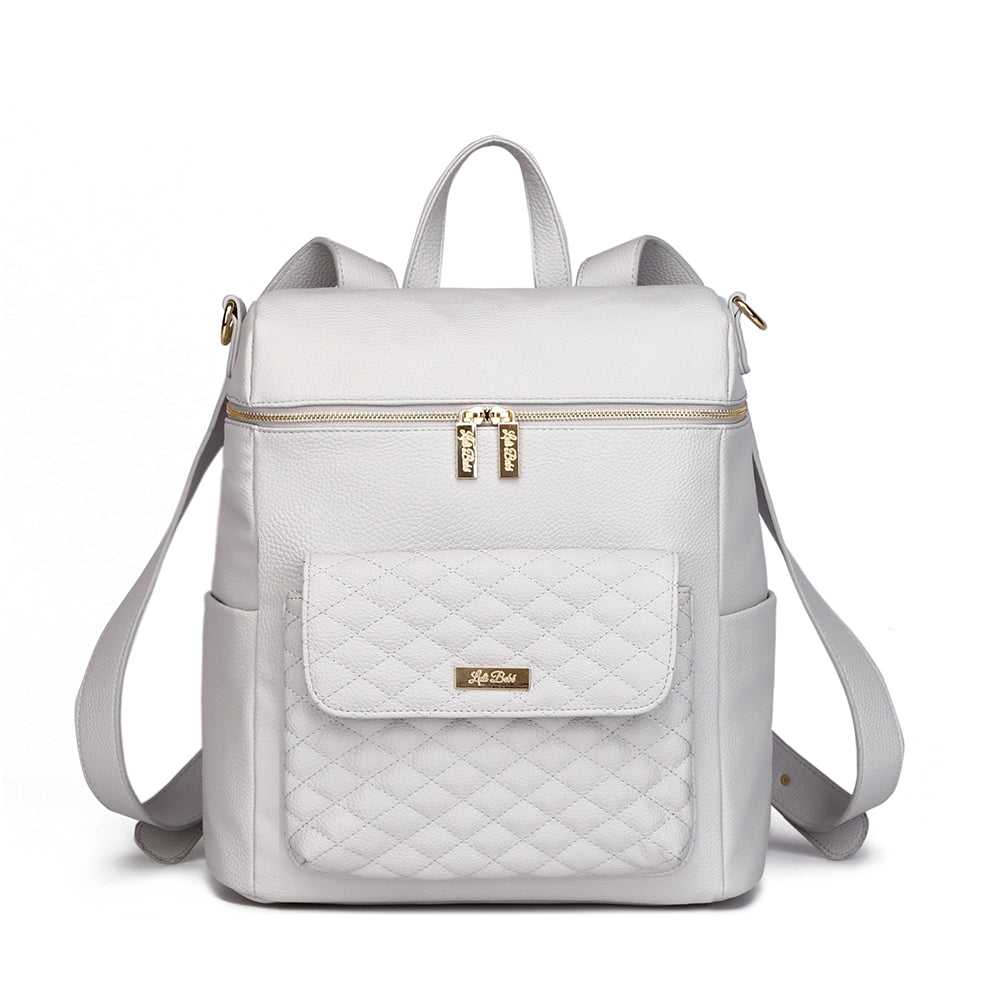 A stone grey Monaco Diaper Bag with premium vegan leather, featuring smooth-glide YKK zippers and a quilted front pocket. It has a structured design with backpack straps and a laptop compartment.
