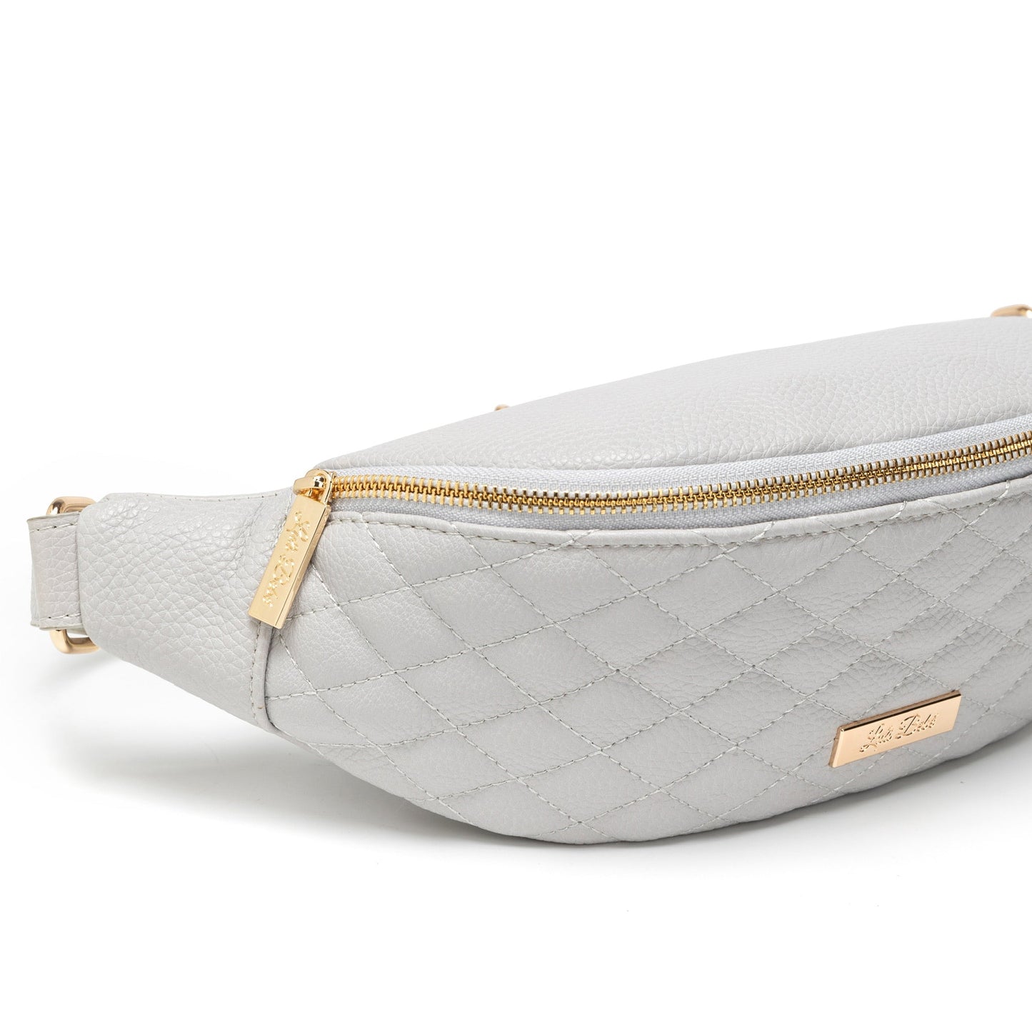 Light gray quilted fanny pack with gold zipper and logo on a white background
