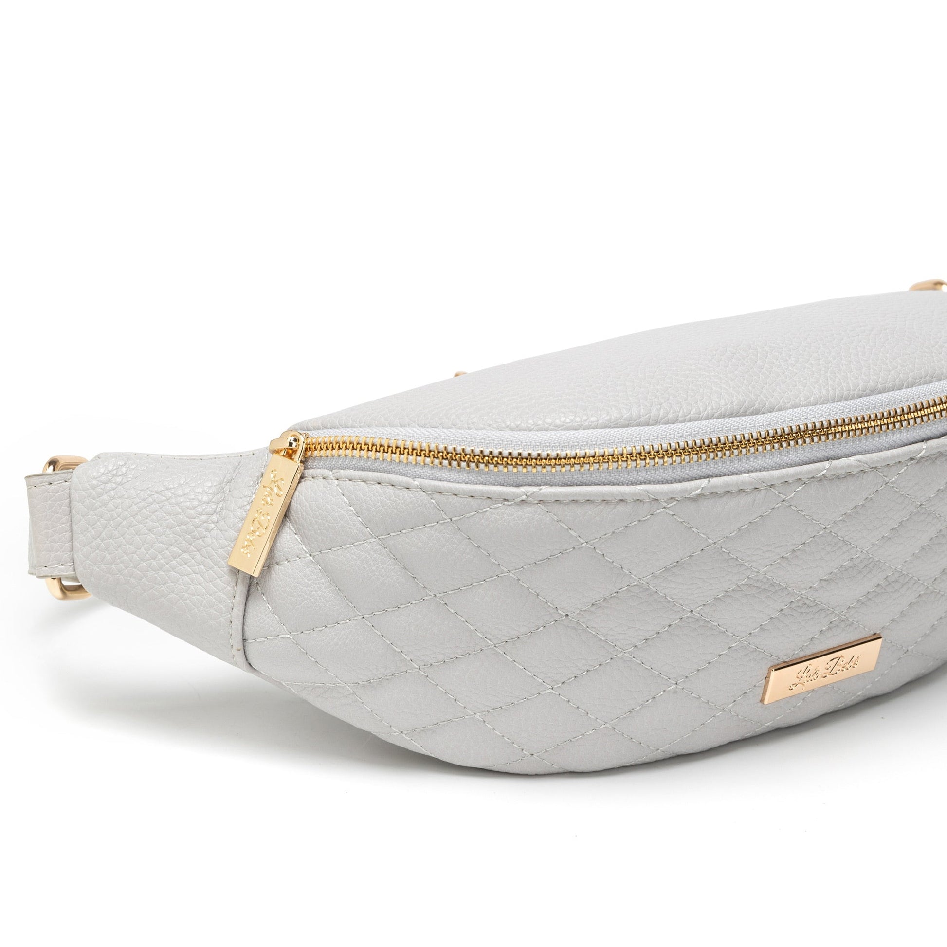 Light gray quilted fanny pack with gold zipper and logo on a white background