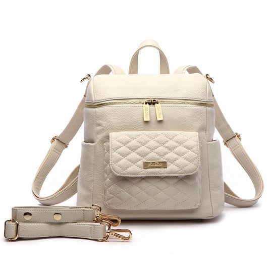 Beige backpack with quilted design and gold accents on a white background
