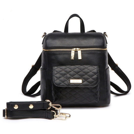 Black backpack with quilted design and gold zippers on a white background