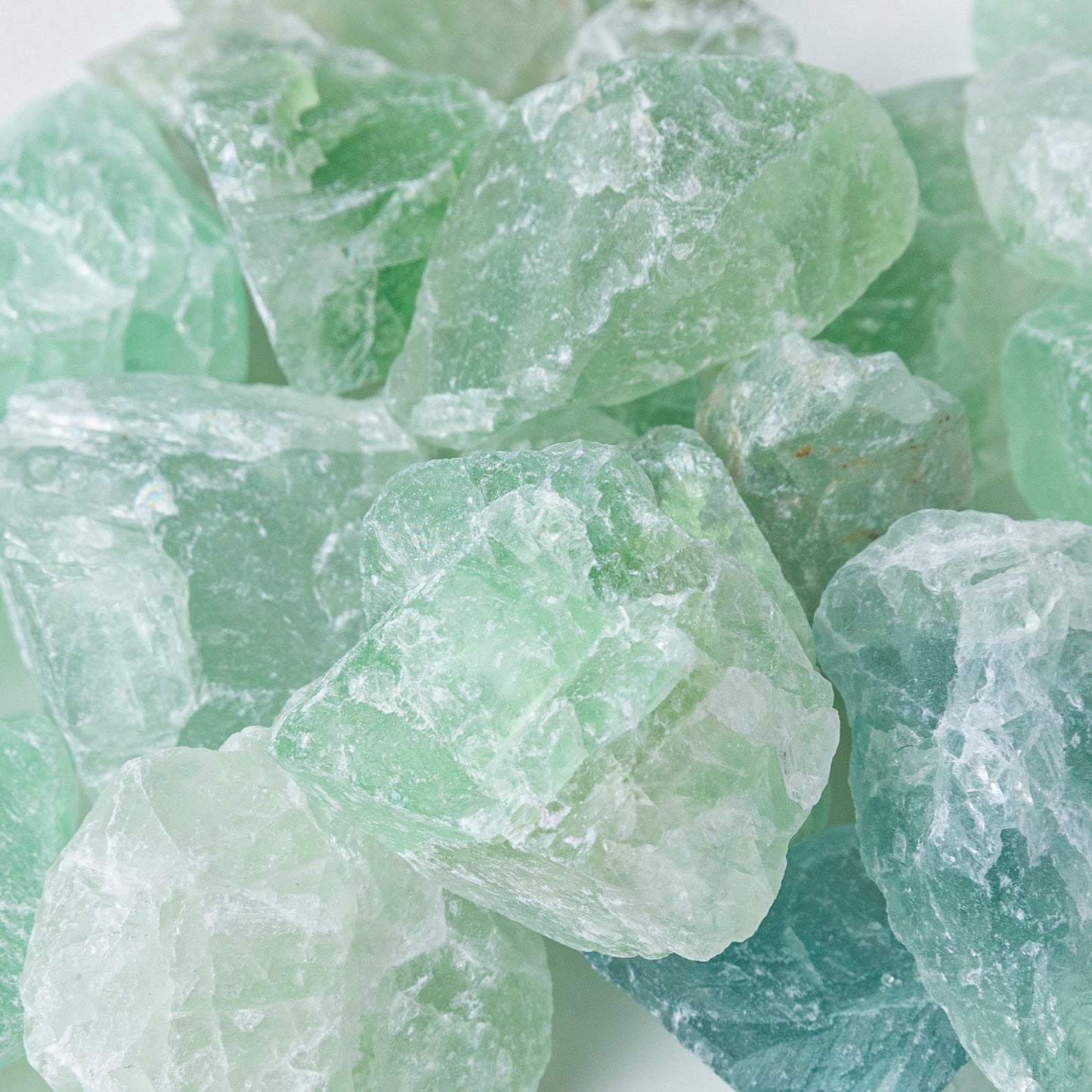 Close-up of green crystals on a white background