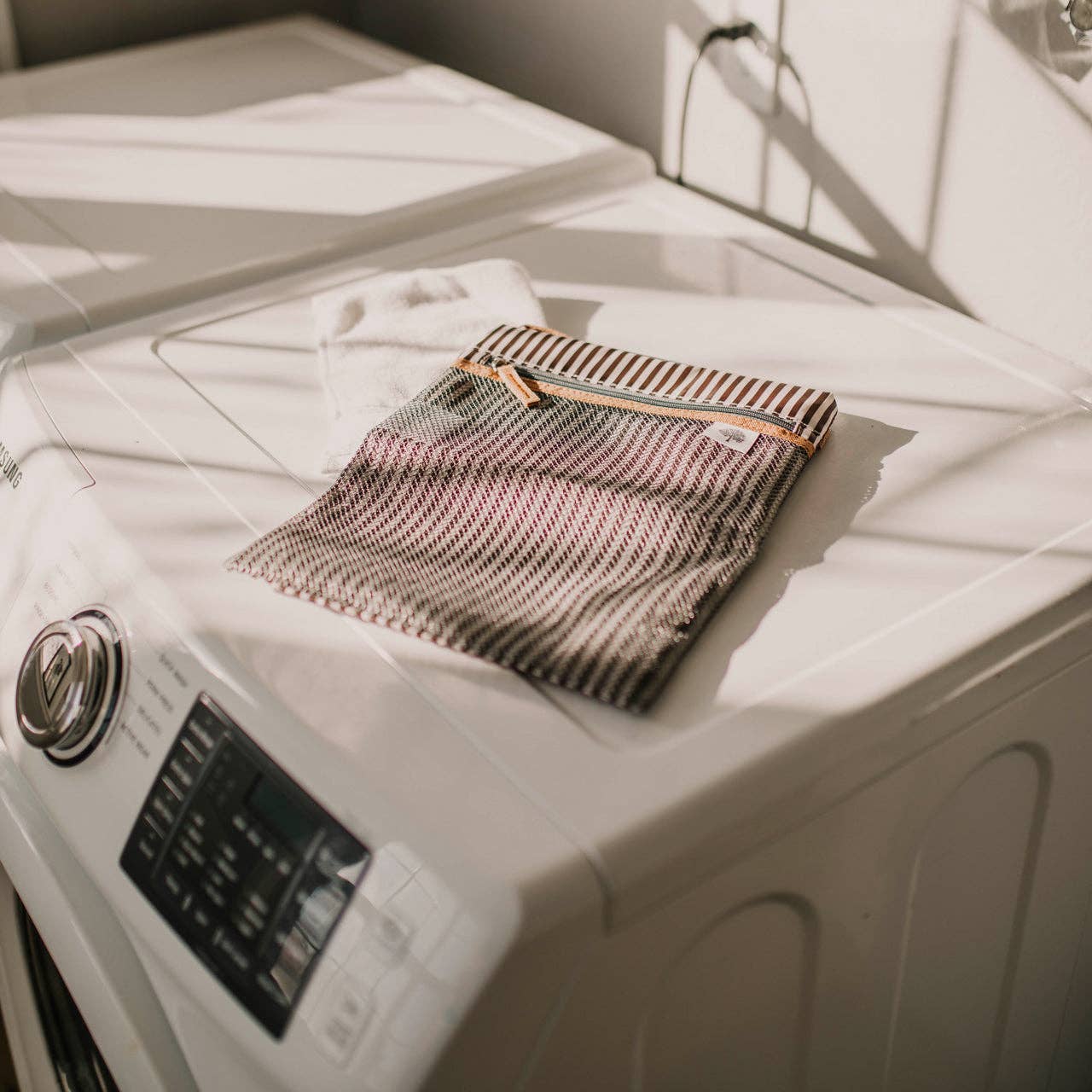 Striped fabric item on a white washing machine