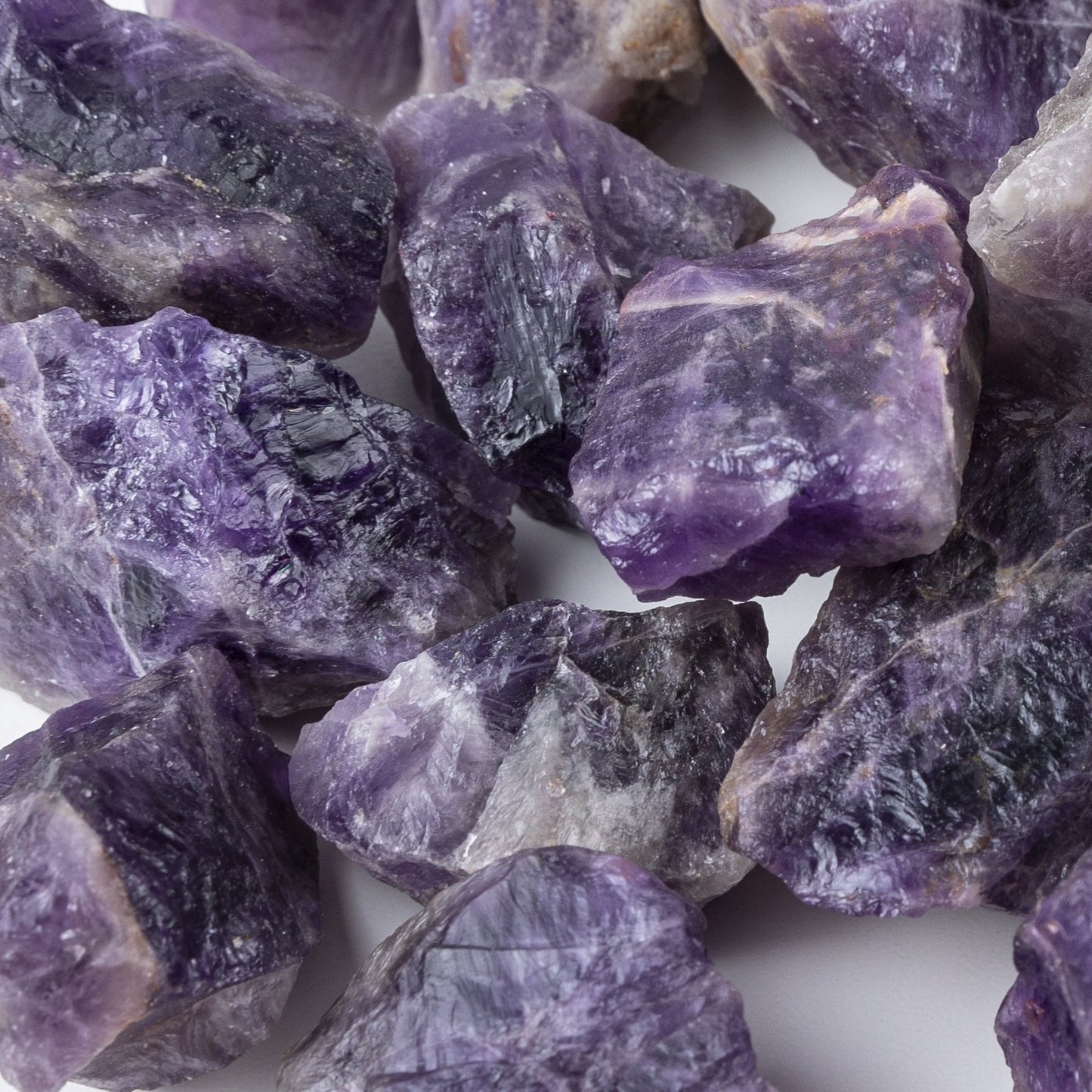 Close-up of purple crystal rocks on a white background