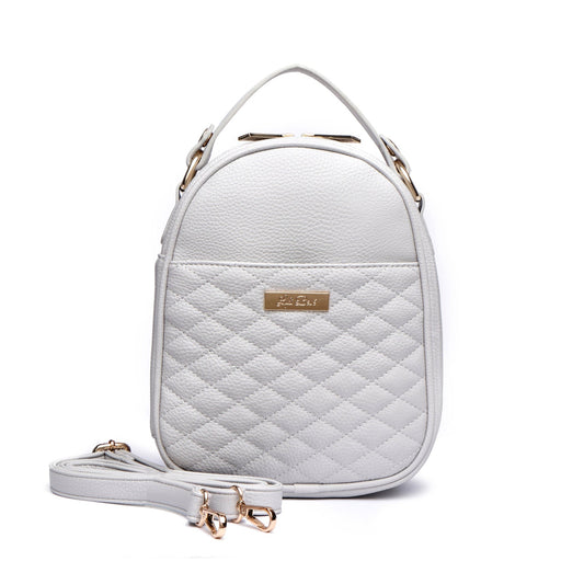 White quilted backpack with gold accents on a white background