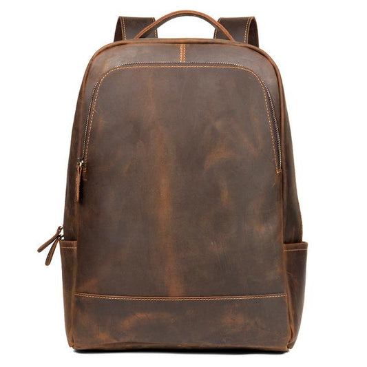Brown leather backpack on a white background