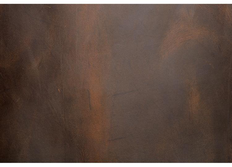 Rust-colored metal surface with a textured pattern