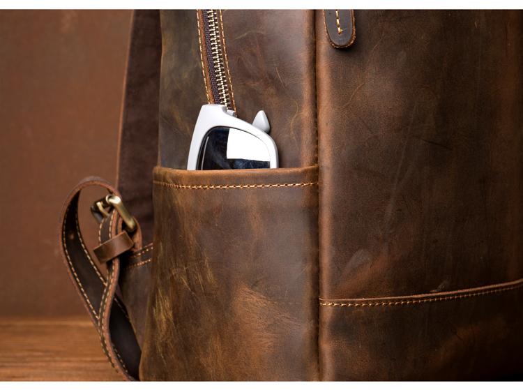 Brown leather bag with a phone in a pocket