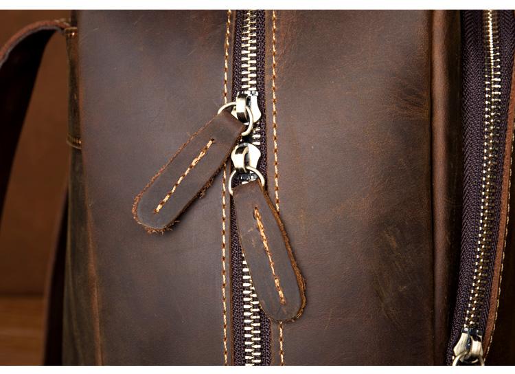 Close-up of a brown leather bag with a zipper