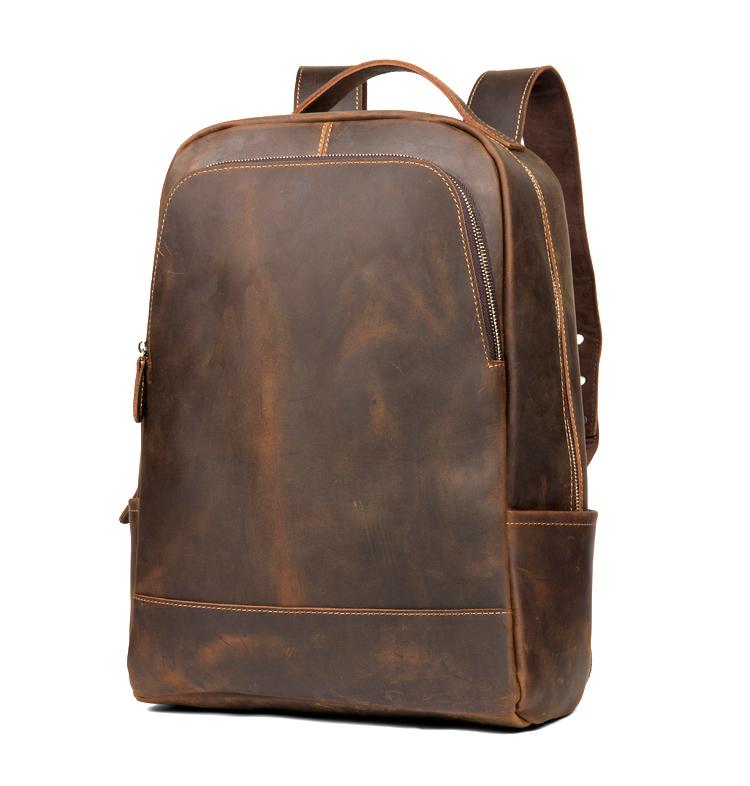 Brown leather backpack on a white background