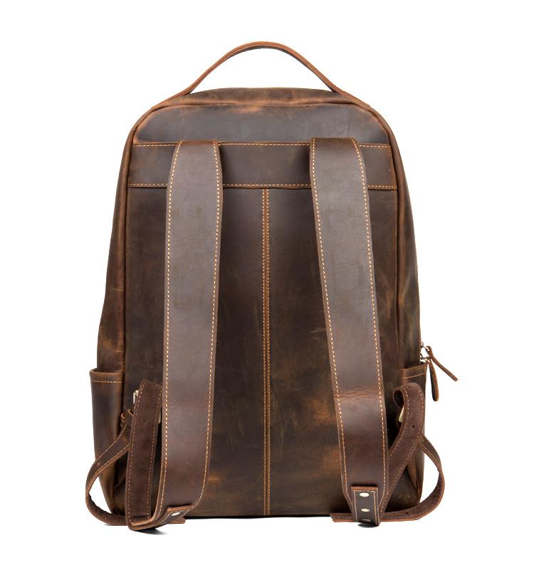 Brown leather backpack on a white background