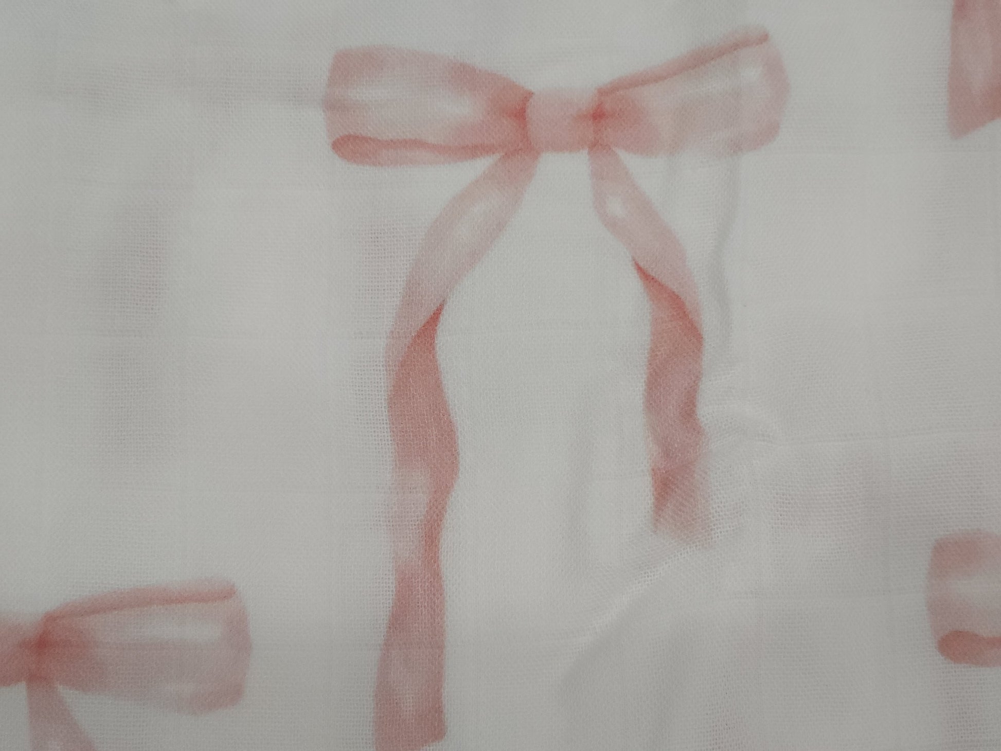 Pink ribbons on a white background