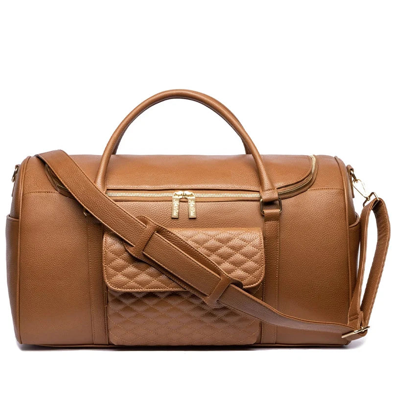 Brown leather duffel bag with a quilted strap on a white background